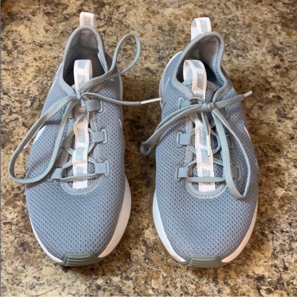 Gray and white Nike tennis shoes size 6.5